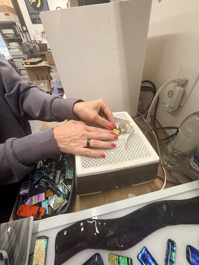 Amy loading a kiln shelf
